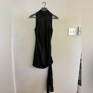 This black high-neck Cinq A Sept dress is great to wear was a wedding guest.